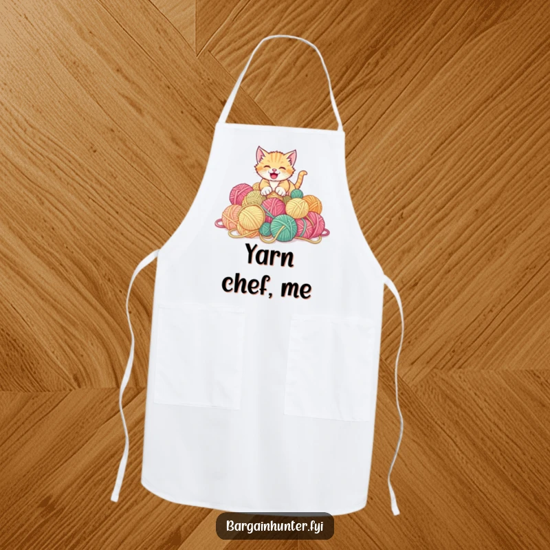 Funny kitten apron showing a gleeful kitten pouncing on a pile of discounted yarn balls.