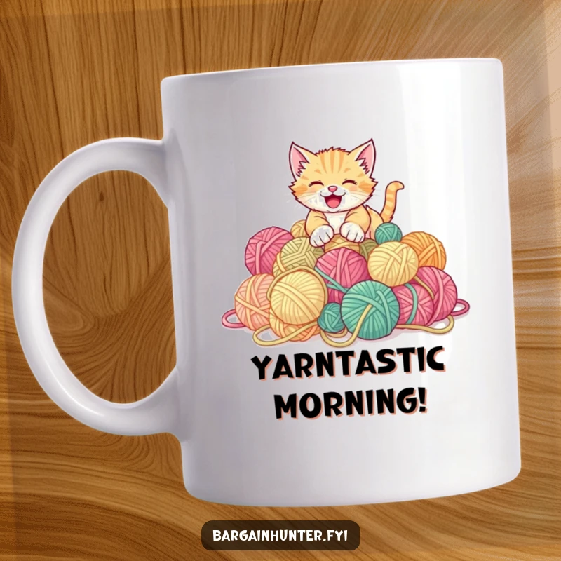 Funny kitten mug showing a gleeful kitten pouncing on a huge pile of discounted yarn balls.