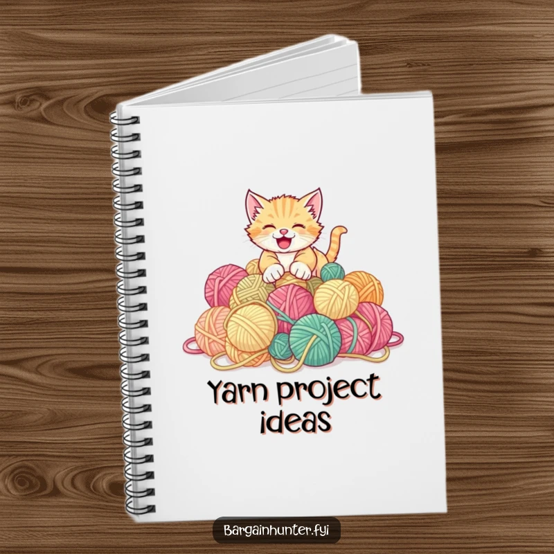Funny kitten notebook featuring a playful kitten pouncing on a pile of discounted yarn balls.